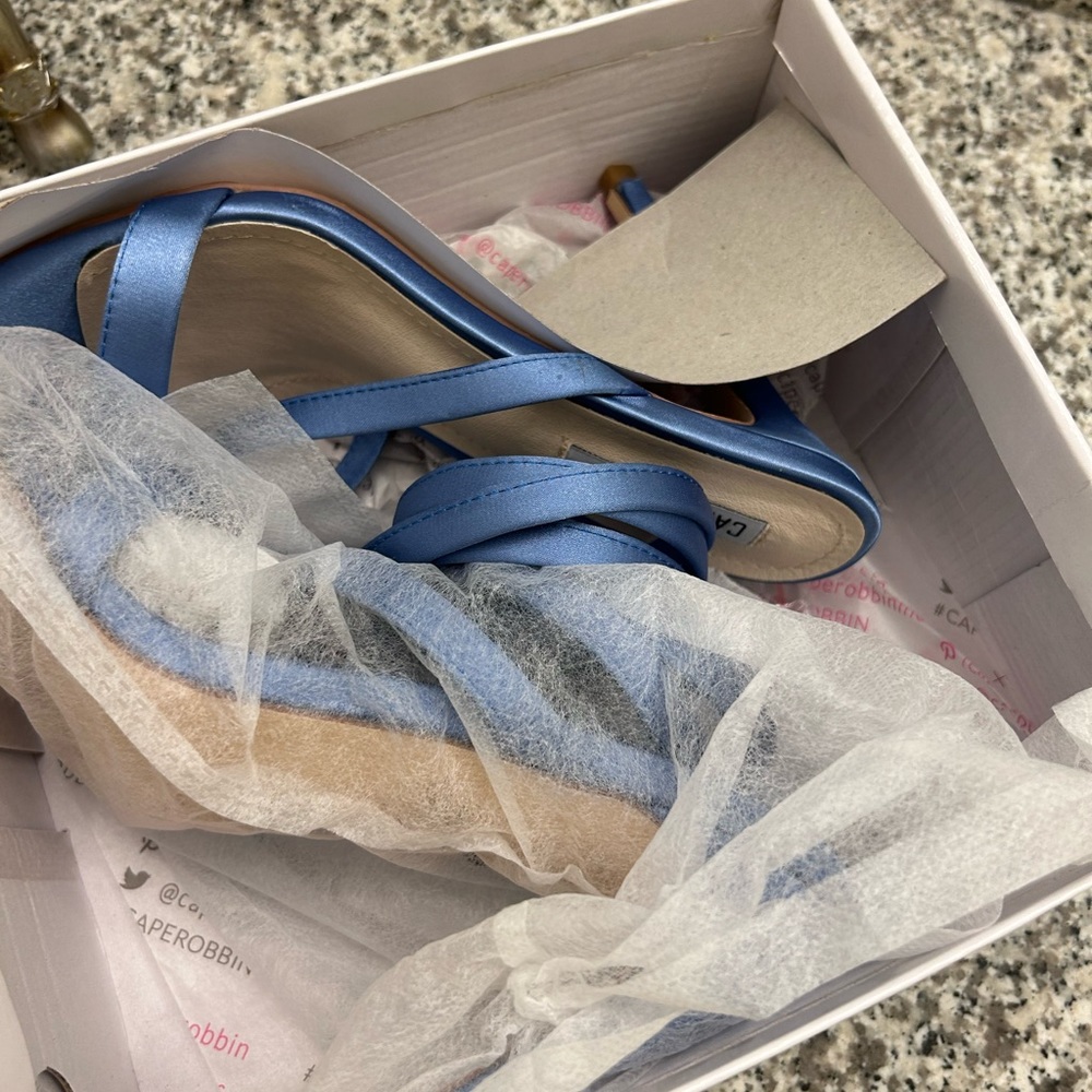 Light blue sandals, never worn purchase for a wedding.